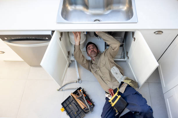 a man repairing toilet